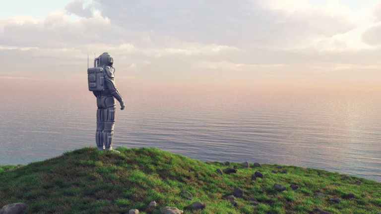 An astronaut standing on a grassy clifftop above the sea