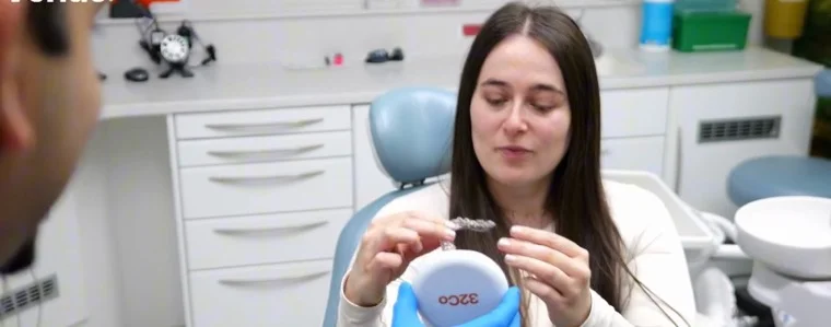 A dentist filming a video in her treatment room